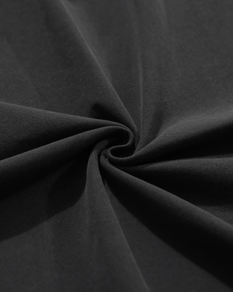 Close-up detail of the cotton fabric texture on the garment dyed drop shoulder heavy tee