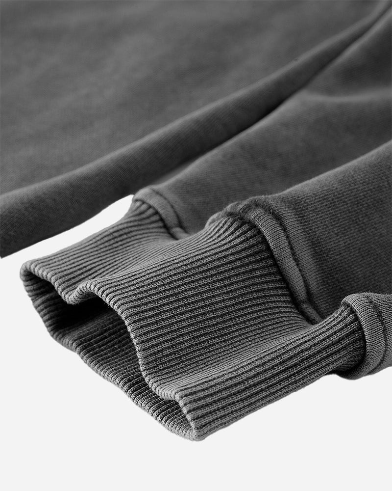 Close-up of the cuff on the Heavy Hoodie in Washed Black, featuring the snug fit and ribbed design for added comfort.