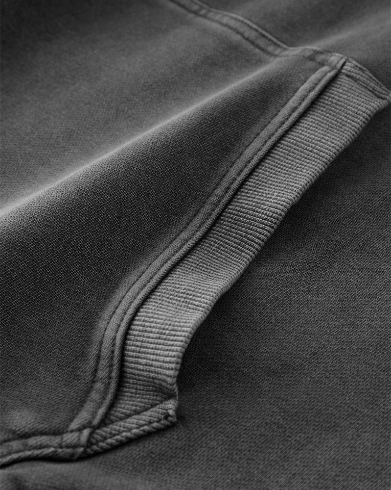 Close-up of the front pocket on the Heavy Hoodie in Washed Black, displaying the durable stitching and spacious design.